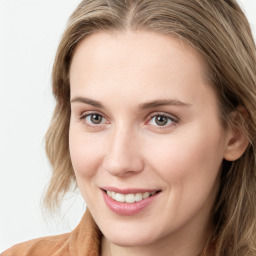 Joyful white young-adult female with long  brown hair and blue eyes