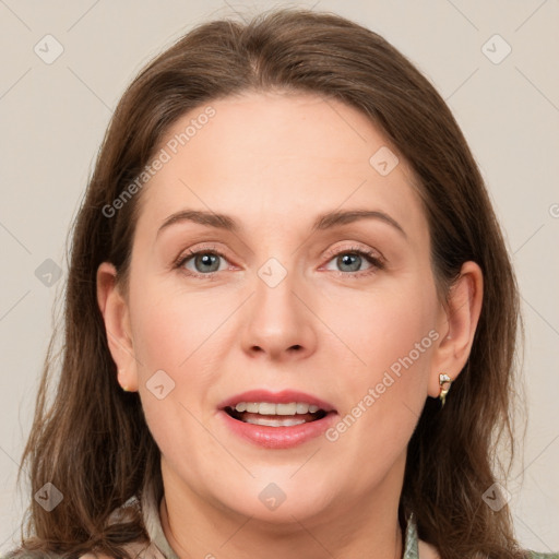 Joyful white adult female with medium  brown hair and grey eyes