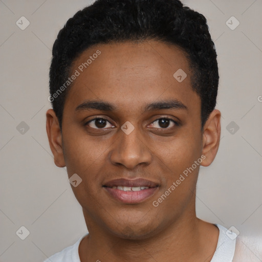 Joyful black young-adult male with short  black hair and brown eyes
