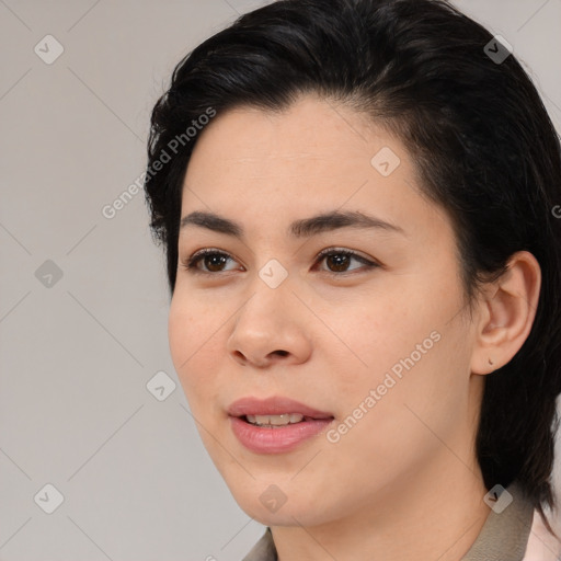 Joyful white young-adult female with medium  black hair and brown eyes