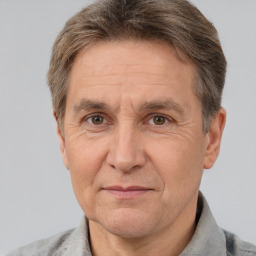 Joyful white middle-aged male with short  brown hair and brown eyes