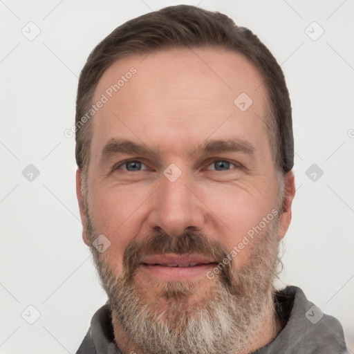 Joyful white adult male with short  brown hair and grey eyes