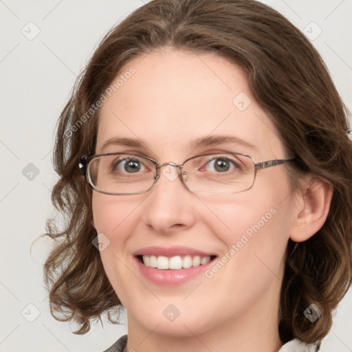 Joyful white young-adult female with medium  brown hair and green eyes