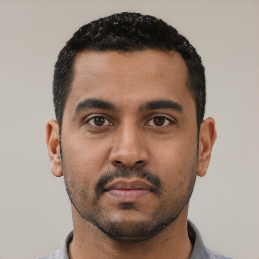 Neutral latino young-adult male with short  black hair and brown eyes