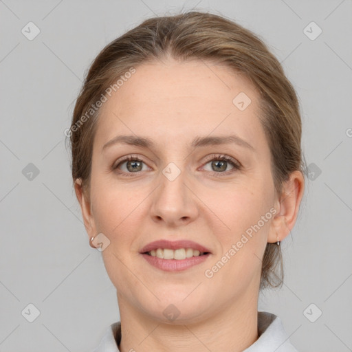 Joyful white adult female with medium  brown hair and grey eyes