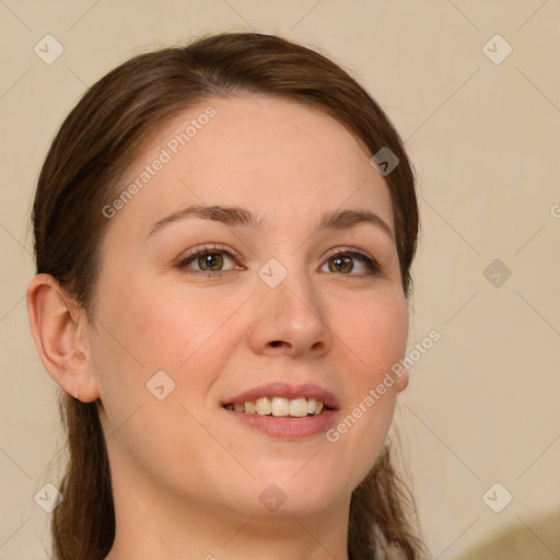 Joyful white young-adult female with long  brown hair and green eyes