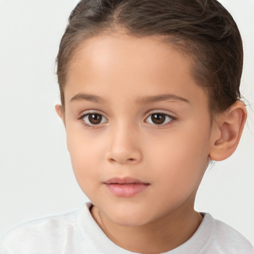 Joyful white child female with short  brown hair and brown eyes