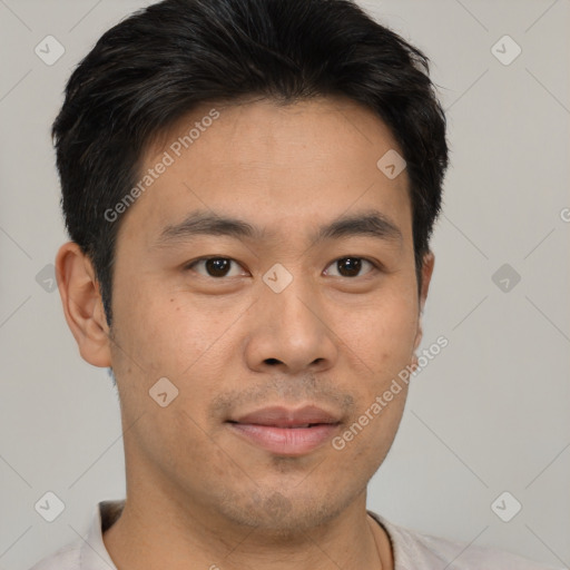 Joyful asian young-adult male with short  brown hair and brown eyes