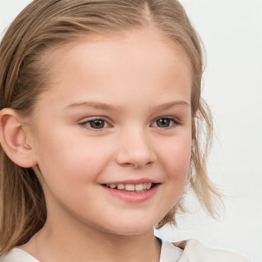 Joyful white child female with medium  brown hair and blue eyes