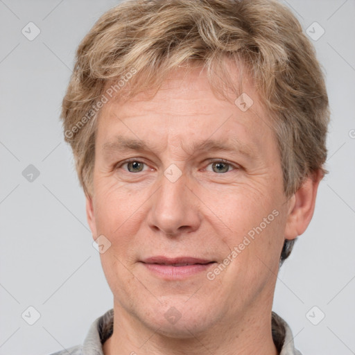 Joyful white adult male with short  brown hair and grey eyes