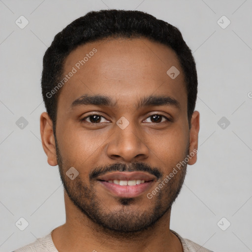 Joyful black young-adult male with short  black hair and brown eyes