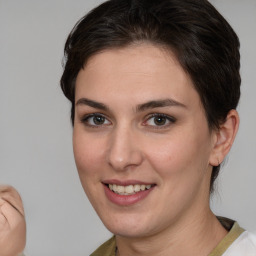 Joyful white young-adult female with medium  brown hair and brown eyes