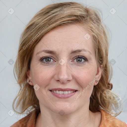 Joyful white young-adult female with medium  brown hair and blue eyes