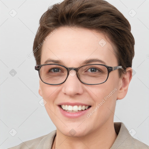 Joyful white young-adult female with short  brown hair and grey eyes