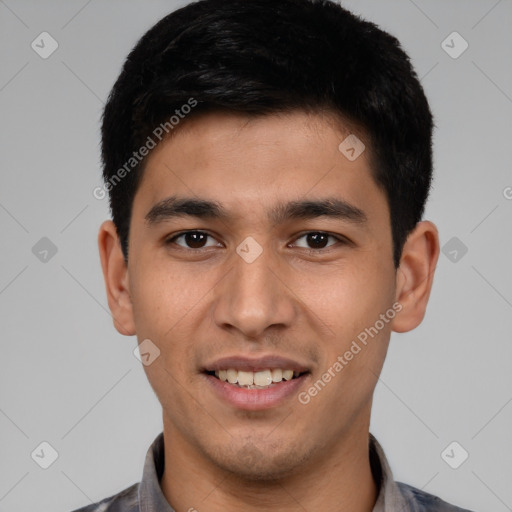 Joyful white young-adult male with short  black hair and brown eyes