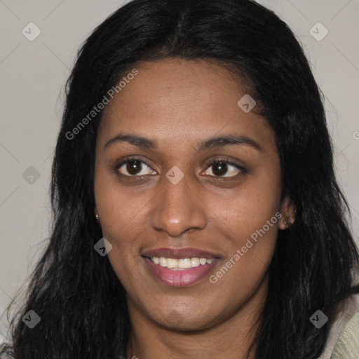 Joyful latino young-adult female with long  black hair and brown eyes