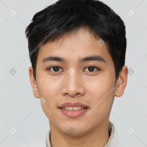 Joyful asian young-adult male with short  brown hair and brown eyes