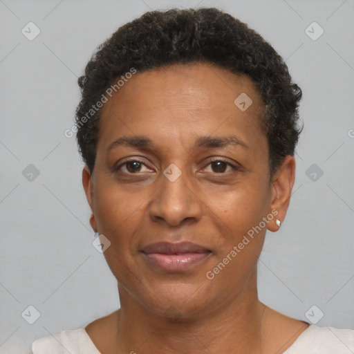 Joyful black adult female with short  brown hair and brown eyes