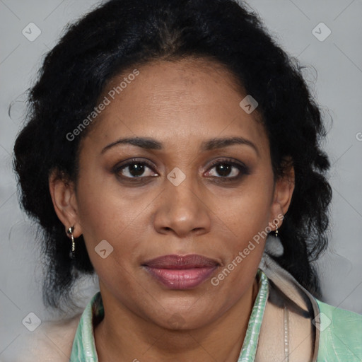 Joyful latino adult female with medium  brown hair and brown eyes