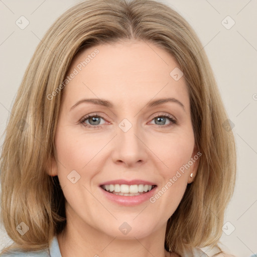 Joyful white young-adult female with medium  brown hair and green eyes