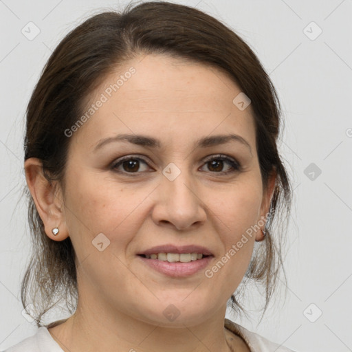 Joyful white adult female with medium  brown hair and brown eyes