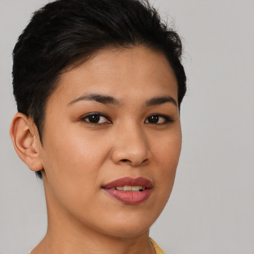 Joyful latino young-adult female with short  brown hair and brown eyes