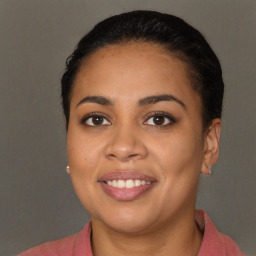 Joyful latino young-adult female with short  brown hair and brown eyes