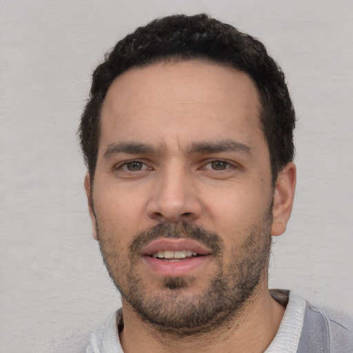 Neutral white young-adult male with short  black hair and brown eyes