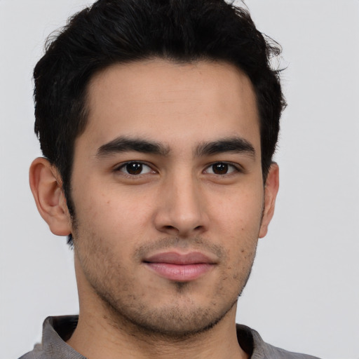 Neutral latino young-adult male with short  brown hair and brown eyes