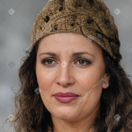 Joyful white adult female with long  brown hair and brown eyes