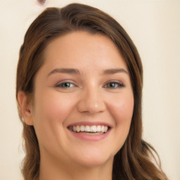 Joyful white young-adult female with long  brown hair and green eyes