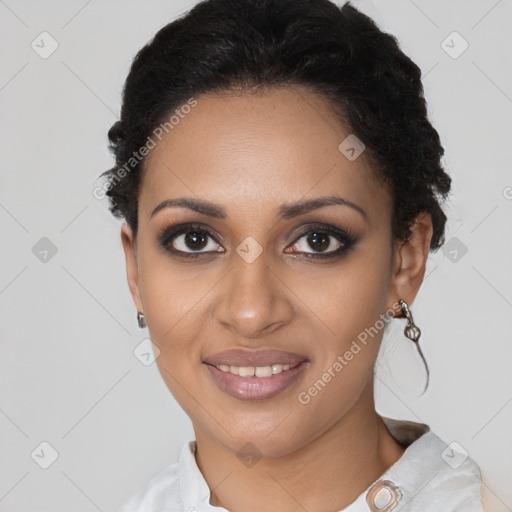 Joyful black young-adult female with short  black hair and brown eyes