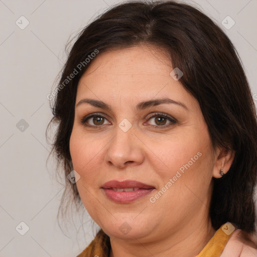 Joyful white adult female with medium  brown hair and brown eyes