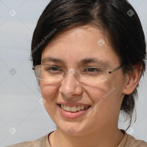 Joyful white adult female with medium  brown hair and brown eyes