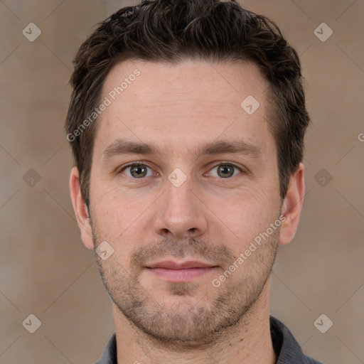 Joyful white adult male with short  brown hair and brown eyes