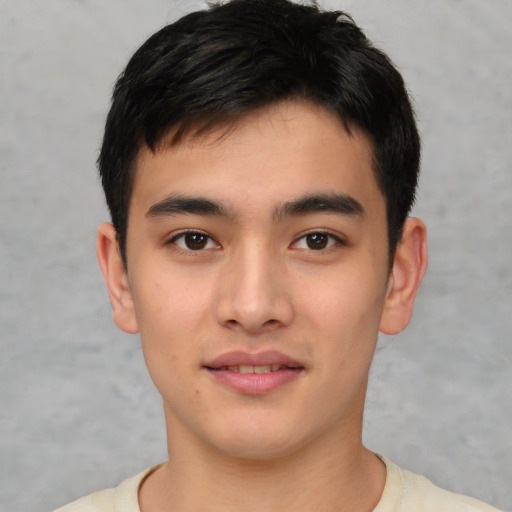 Joyful asian young-adult male with short  black hair and brown eyes