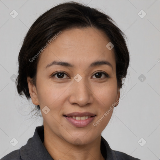 Joyful latino adult female with medium  brown hair and brown eyes