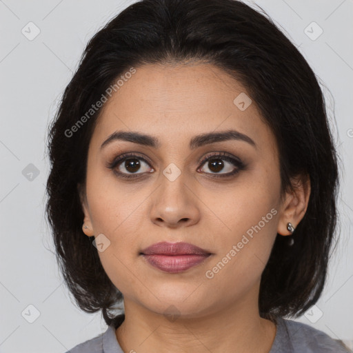 Joyful latino young-adult female with medium  brown hair and brown eyes