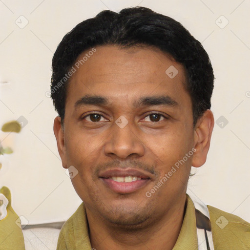 Joyful latino adult male with short  black hair and brown eyes