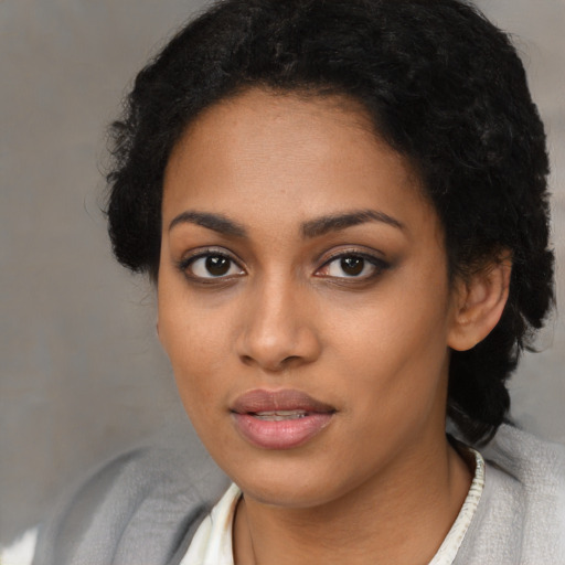 Neutral black young-adult female with long  black hair and brown eyes