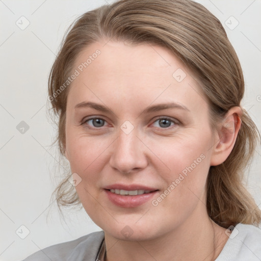 Joyful white young-adult female with medium  brown hair and blue eyes