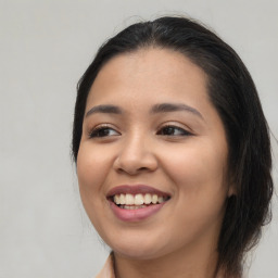 Joyful asian young-adult female with medium  brown hair and brown eyes