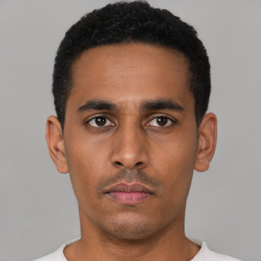 Neutral latino young-adult male with short  black hair and brown eyes