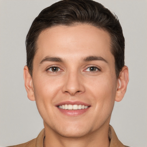 Joyful white young-adult male with short  brown hair and brown eyes