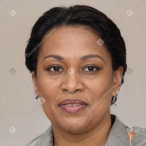 Joyful latino adult female with short  brown hair and brown eyes