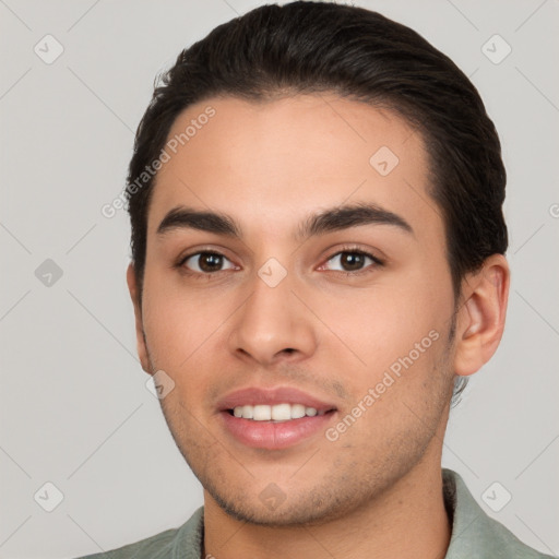 Joyful white young-adult male with short  brown hair and brown eyes