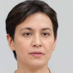 Joyful white adult female with short  brown hair and brown eyes