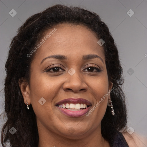 Joyful latino adult female with long  brown hair and brown eyes