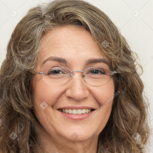 Joyful white adult female with long  brown hair and brown eyes