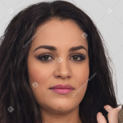 Joyful latino young-adult female with long  brown hair and brown eyes